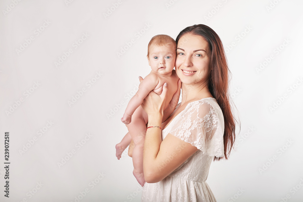 Portrait happy smiling mother with baby on white background. Happy smiling mother with baby having fun together on white background. Young beautiful woman with small child in her arms. Portrait happy smiling mother with baby on white background. Happy smiling mother with baby having fun together on white background. Young beautiful woman with small child in her arms.