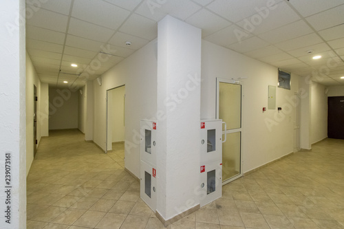 modern hotel corridor with white doors
