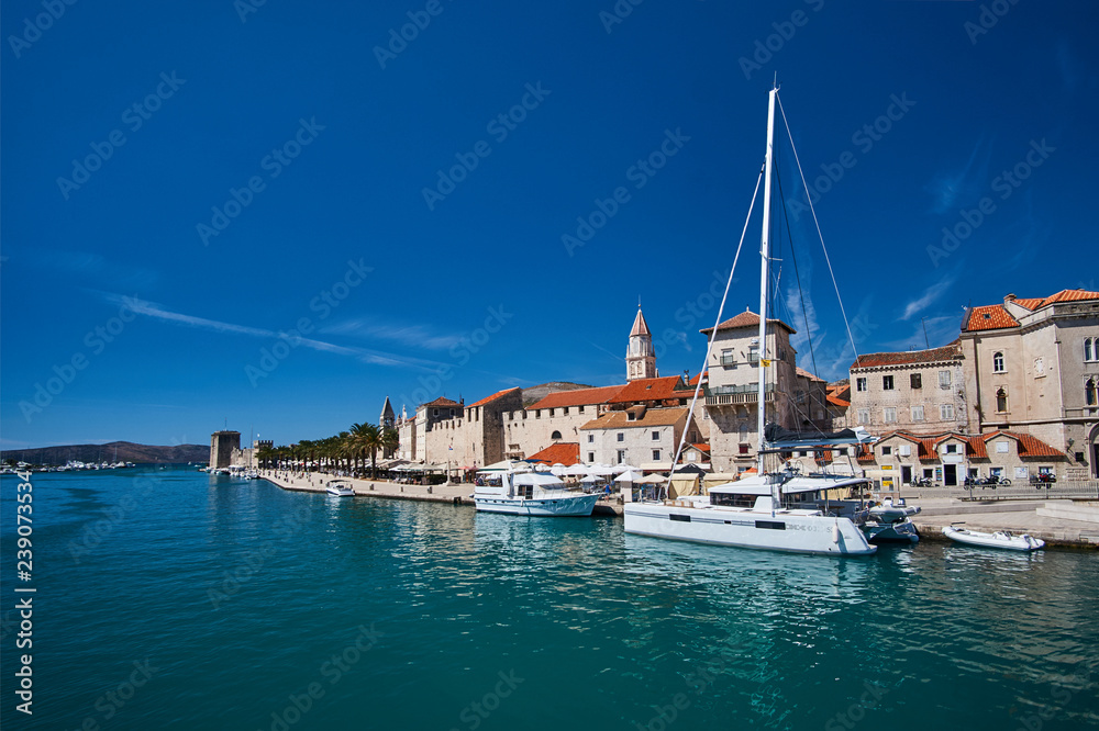 Sailboats and yachts in the port of Trogir in Croatia.