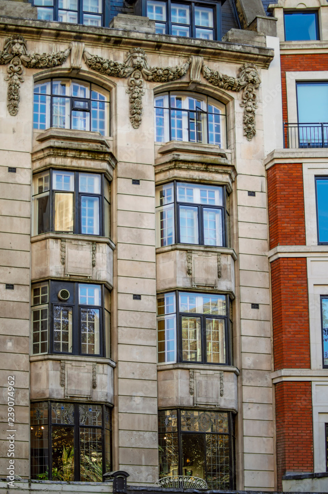 Large roman windows of apartment in london