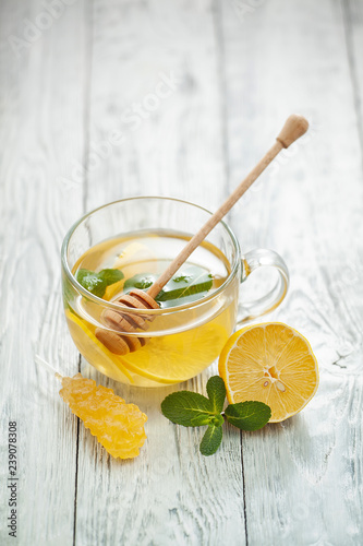 healthy drink for the treatment of colds. Cup of hot tea with lemon, mint and honey