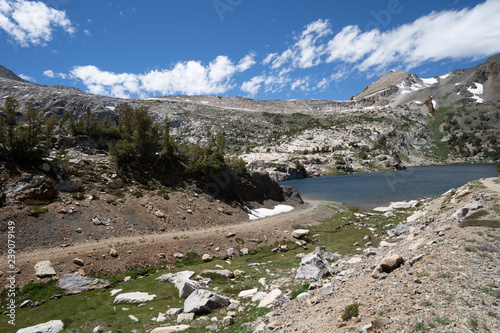 Steelhead Lake in the 20 Lakes Basin area of California, along a hiking trail on a summer day in the Sierra Nevada Mountains