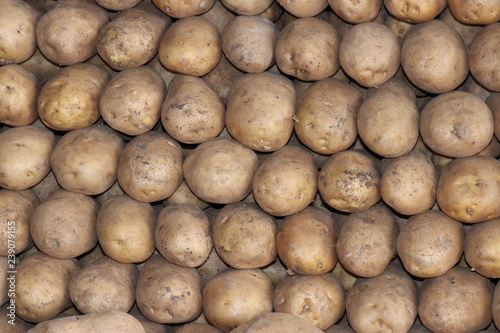Stacked Potatoes On The Counter In The Market Stock Photo