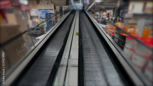 Wallpaper Mural Two escalators - going up and going down inside the store Torontodigital.ca