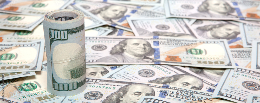 Fototapeta premium Stack of dollars on money background