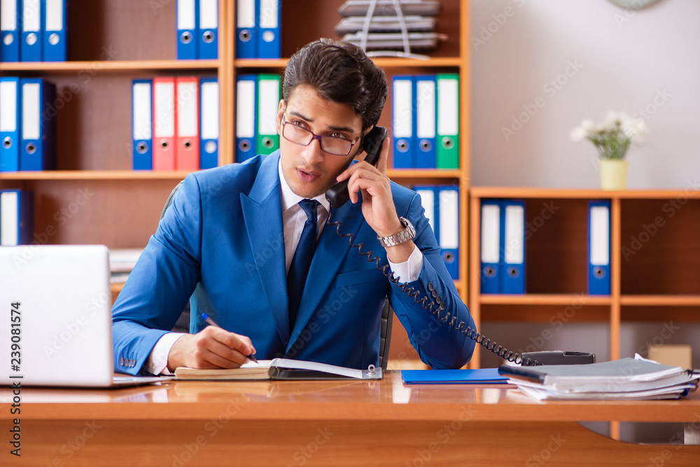 Young employee working in the office