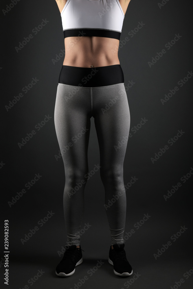 © muro - Happy young woman in sports clothing smiling © muro - Happy young woman in sports clothing smiling