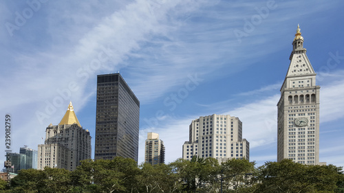 manhattan buildings skyline day new york city Madison Square Park few of buildings on a nice day blue sky with wispy clouds