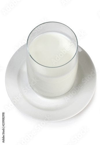 Glass pitcher with milk on white background