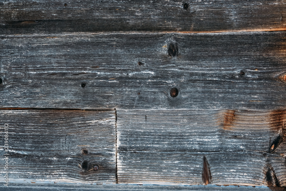 Obraz premium Brown wood wall background texture. Planks of wood damaged by the aging process. Old wooden wall.
