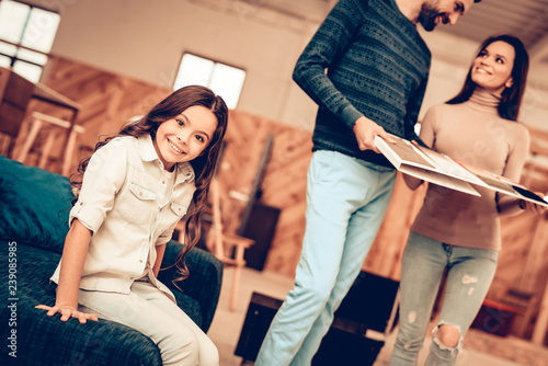 Couple With Daughter Went To The Furniture Store.