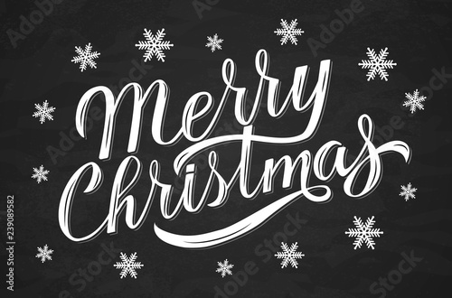 Merry Christmas hand drawn calligraphy lettering surrounded by snowflakes on chalkboard. Holidays vector illustration.