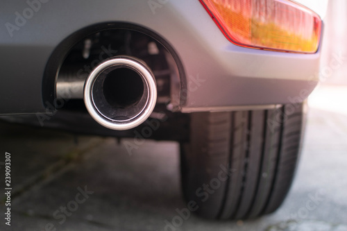 Close up, exhaust pipe of family car 