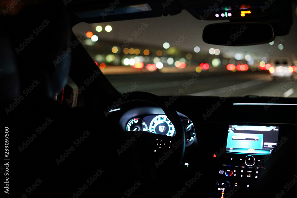 driving a car at night in the city