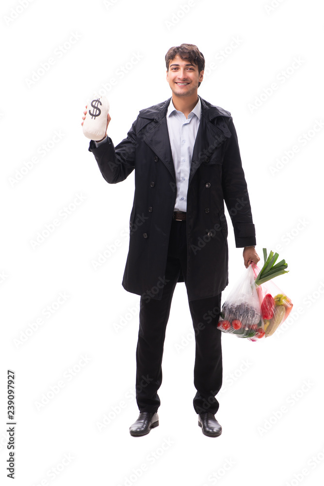 Young handsome man with vegatables in shopping concept Young handsome man with vegatables in shopping concept