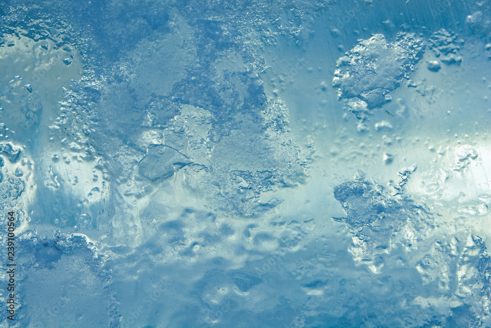 The texture of the ice. The frozen water.Winter background The texture of the ice. The frozen water.Winter background