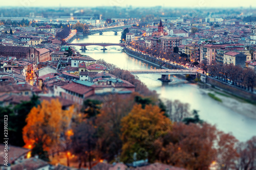 Verona panoramic aerial view on illuminated old town on the sunset in Italy, retro tone filter