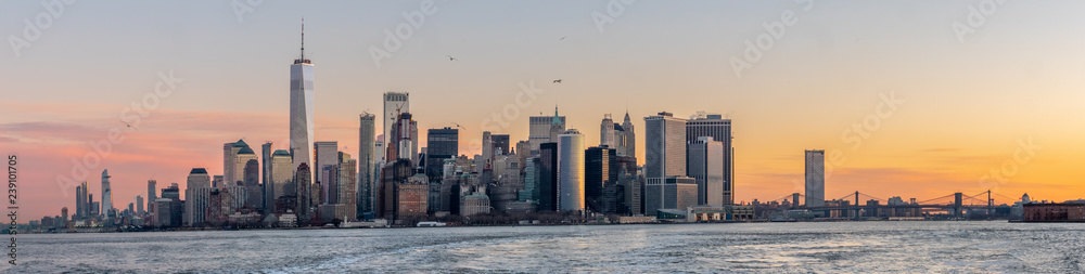 Downtown Manhattan Skyline with Orange Skies during a Winter Sunrise