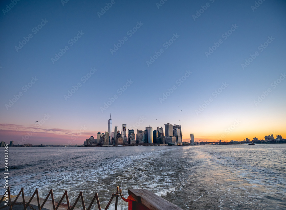 Wide Angle View of the Manhattan Skyline At Sunrise From the Ferry