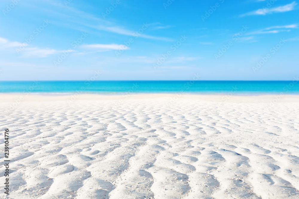 White sand curve or tropical sandy beach with blurry blue ocean ...
