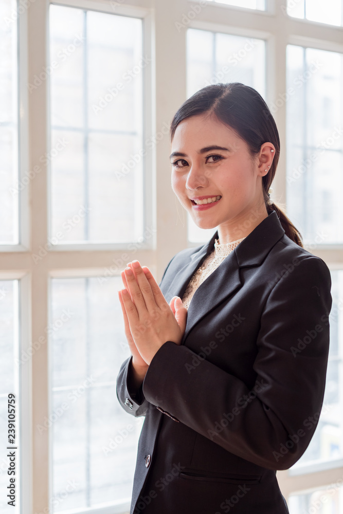 Thailand woman people acting sawaddee(Hello) near windows. Thailand woman people acting sawaddee(Hello) near windows.