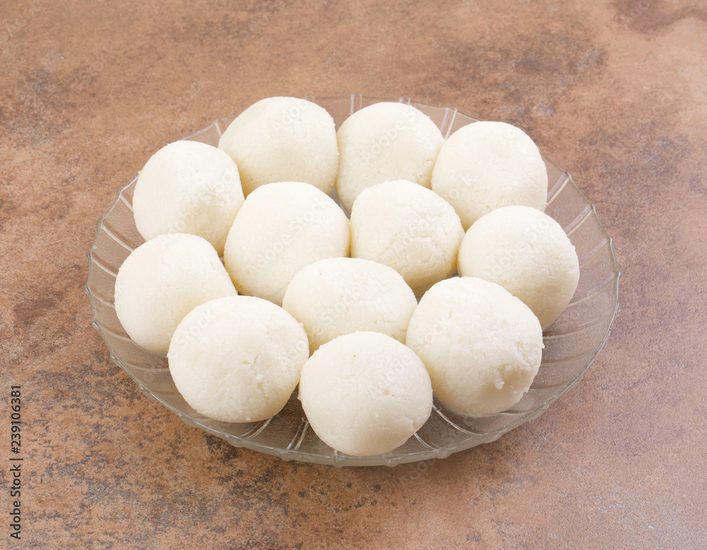 Indian Sweet Rasgulla Also Know as Rosogolla, Roshogolla, Rasagola, Ras Gulla, Anguri Rasgulla or Angoori Rasgulla is a Syrupy Dessert Popular in India. It is Made From Ball Shaped Dumplings Indian Sweet Rasgulla Also Know as Rosogolla, Roshogolla, Rasagola, Ras Gulla, Anguri Rasgulla or Angoori Rasgulla is a Syrupy Dessert Popular in India. It is Made From Ball Shaped Dumplings