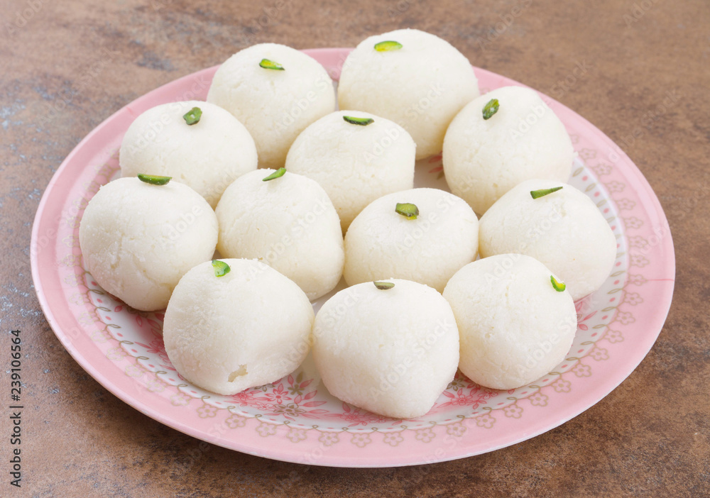 Indian Sweet Rasgulla Also Know as Rosogolla, Roshogolla, Rasagola, Ras Gulla, Anguri Rasgulla or Angoori Rasgulla is a Syrupy Dessert Popular in India. It is Made From Ball Shaped Dumplings Indian Sweet Rasgulla Also Know as Rosogolla, Roshogolla, Rasagola, Ras Gulla, Anguri Rasgulla or Angoori Rasgulla is a Syrupy Dessert Popular in India. It is Made From Ball Shaped Dumplings