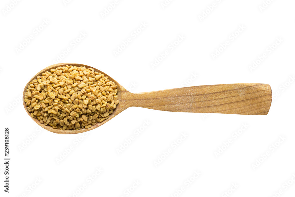 fenugreek seed in wooden spoon isolated on white background. spice for cooking food, top view. fenugreek seed in wooden spoon isolated on white background. spice for cooking food, top view.