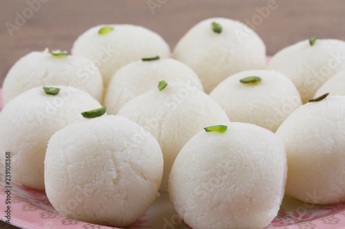 Indian Sweet Rasgulla Also Know as Rosogolla, Roshogolla, Rasagola, Ras Gulla, Anguri Rasgulla or Angoori Rasgulla is a Syrupy Dessert Popular in India. It is Made From Ball Shaped Dumplings photo