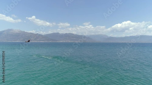 Aerial view of person jumping windsurfing at the Gulf of Patras, Greece.