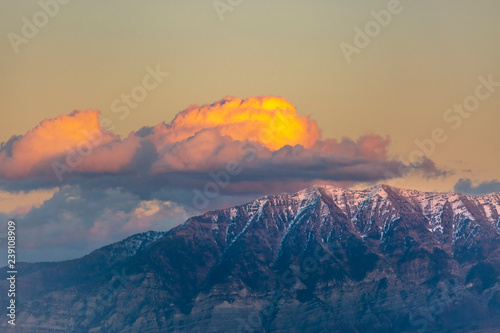Clouds are lit up by sunset over Timpanogos