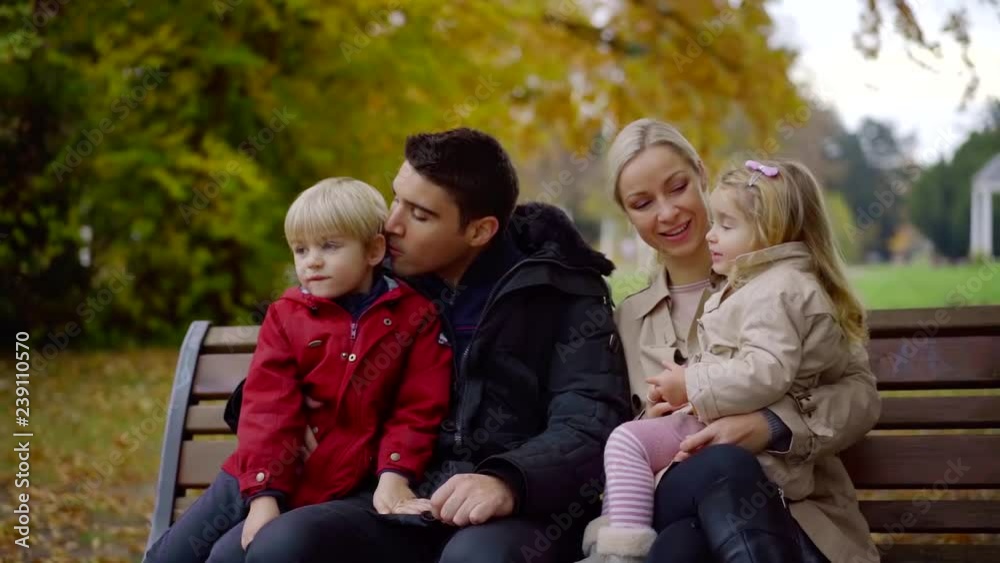 Portrait of a strong family spending day in a park. Portrait of a strong family spending day in a park.