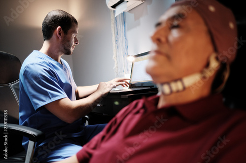 EEG Test on an Elderly Man at Hospital Laboratory