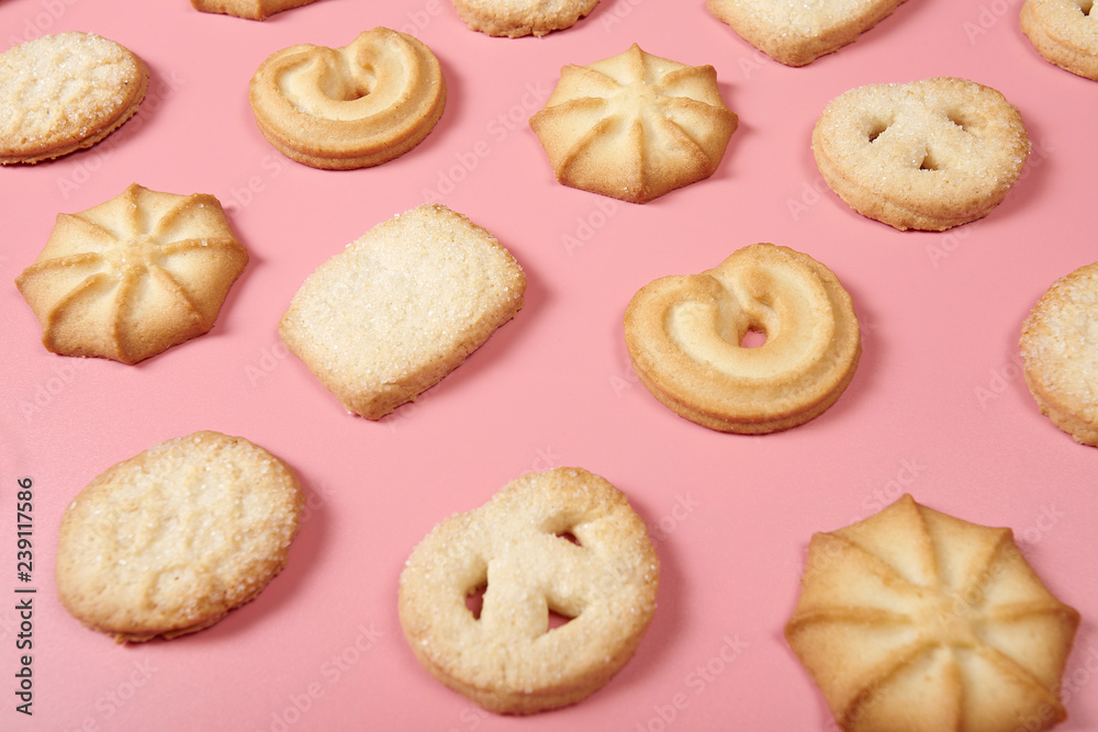Danis butter cookies on pink background. Close-up.