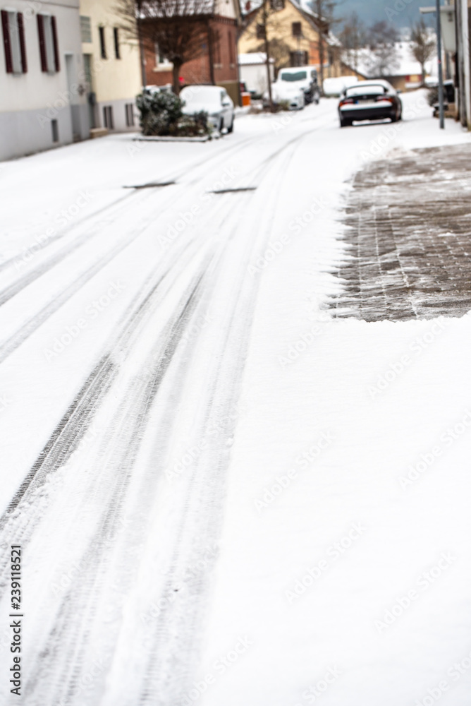 covered with snow, a slippery street in the town covered with snow, a slippery street in the town