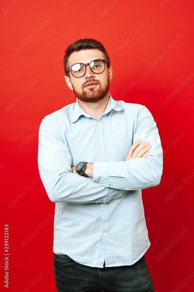 Seriously hipster bearde man with crossed hands Seriously hipster bearde man with crossed hands