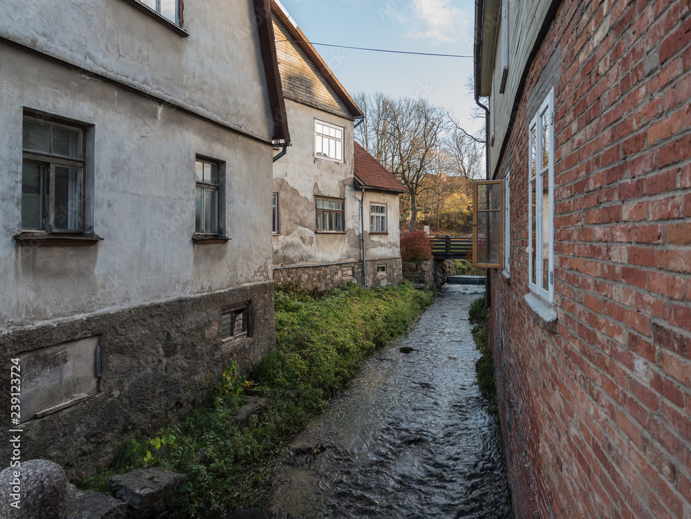 River between houses in old town. River between houses in old town.