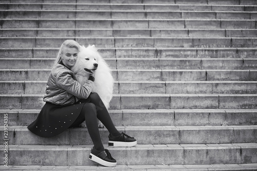 Lovely girl on a walk with a beautiful dog