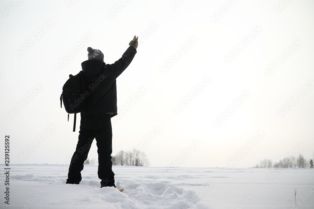 A man on a walk. Winter landscape. Tourist in winter journey. A man on a walk. Winter landscape. Tourist in winter journey.