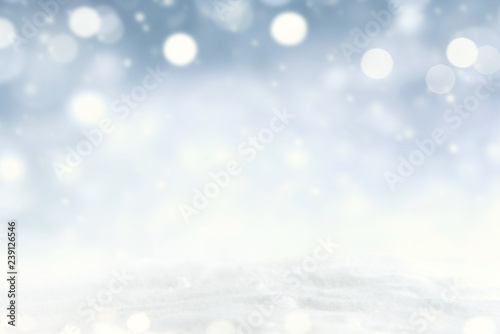 Snowflakes and snowfall on a cold blue winter background.
