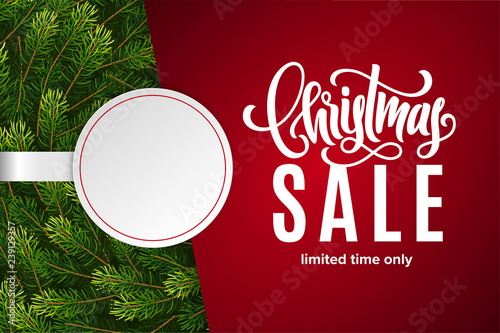 Christmas holiday sale with copy space on paper sticker. Red background with fir tree branches. Limited time only. Template for a banner, poster, shopping, discount