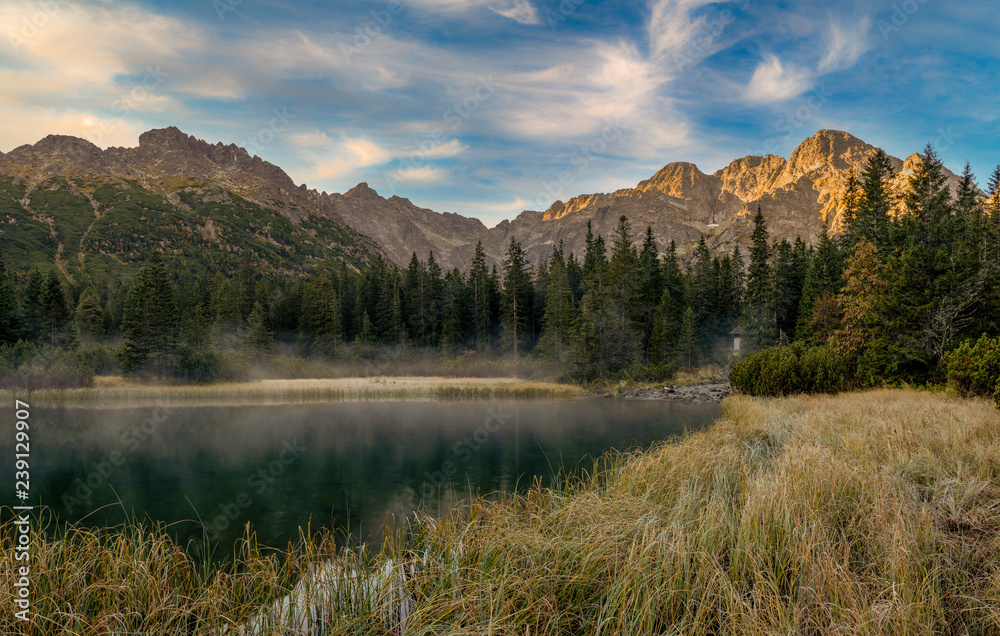 Panorama of a mountain lake during sunrise - Morskie Oko, Tatra Mountains, Poland