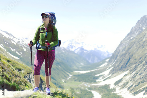 Hiker. Woman hiking smiling happy on trek with backpack during summer outdoors activity. Fresh joyful multiethnic Asian Caucasian female model walking in Yosemite National Park, California, USA