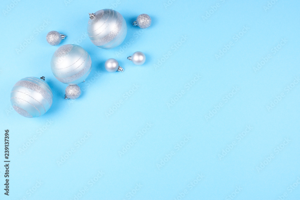 Christmas baubles on blue background.