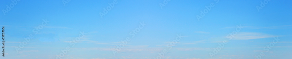 Empty Blue Sky Background, Simple Natural Texture Template of Sky with Small Clouds. Backdrop of Pale Light Bright Blue Color, Blur Sky Texture, Blank Wallpaper, Poster or Banner for Copy Space
