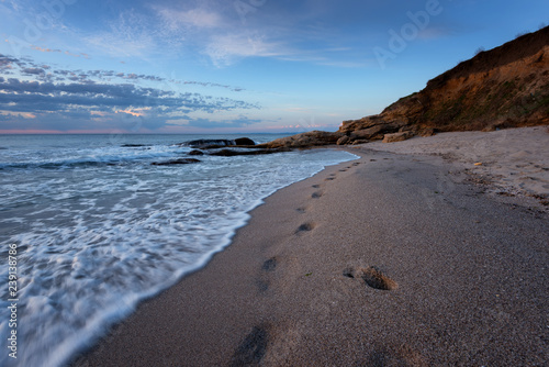 Seascape during sunrise. Beautiful natural seascape. Sea sunrise at the Black Sea coast. Magnificent sunrise with clouds and fire sun at the beginning of April.Ravda  Bulgaria