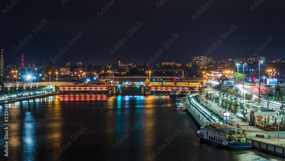 CITY AT NIGHT - Ship on the river, bridge and landscape of Szczecin in the night illumination