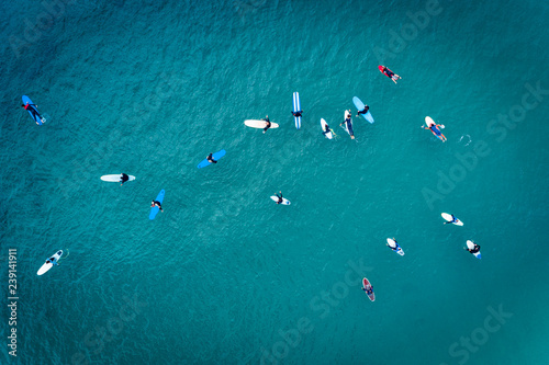 Aerial view of surfers in the ocean at the Baleal beach in Peniche, Portugal