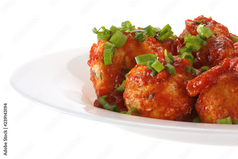 Meatballs in tomato sauce served on a plate. Isolated on white background. Meatballs in tomato sauce served on a plate. Isolated on white background.