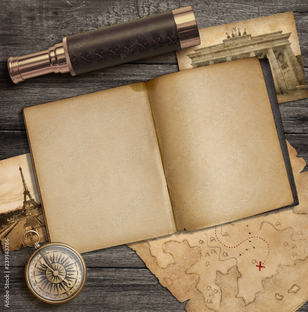 Fototapeta premium Diary and vintage travel accessories top view. Adventure and exploration concept.